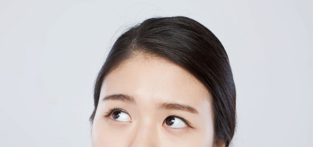Female looking up wearing ACUVUE contact lenses, Malaysia